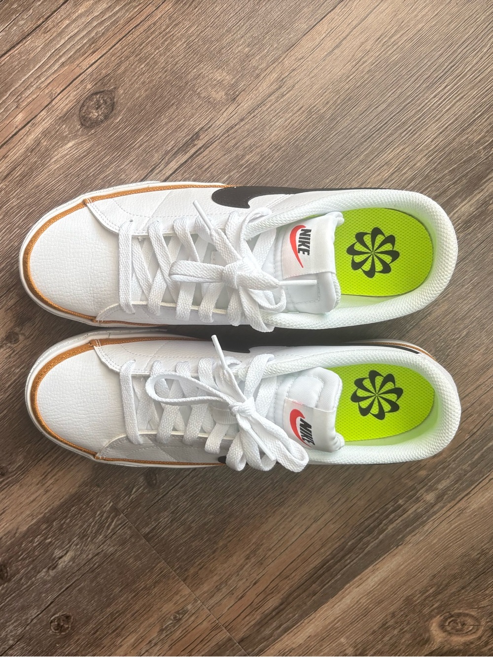 Women’s Nike White Sneakers with Black Swoosh and Lime Insole